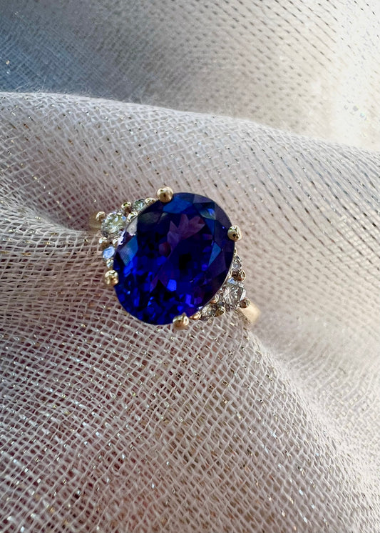 Oval Tanzanite with trio of diamonds