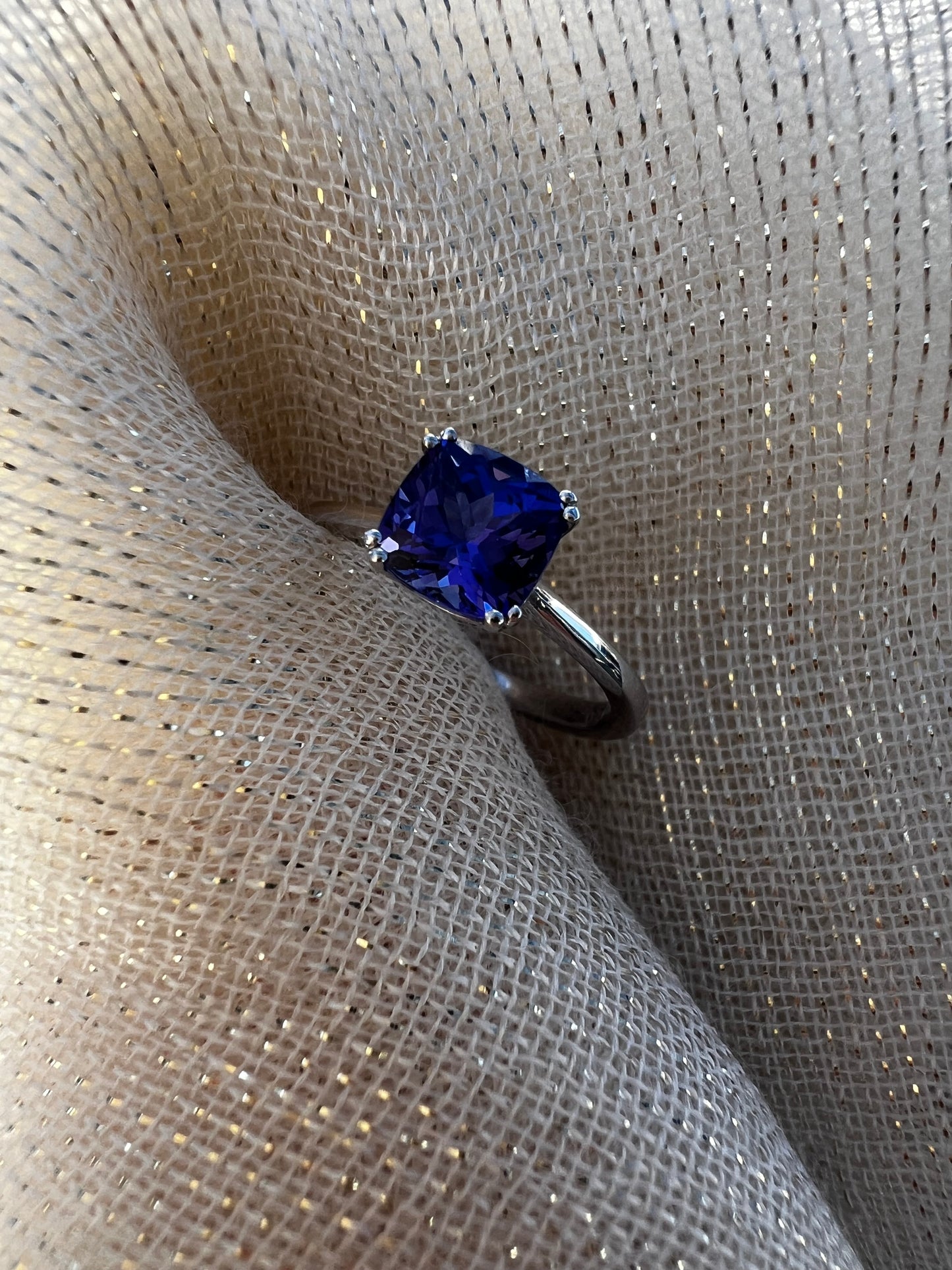 Cushion cut Tanzanite ring in white gold.