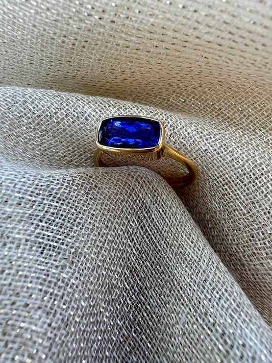 Tanzanite Bezel set ring in yellow gold