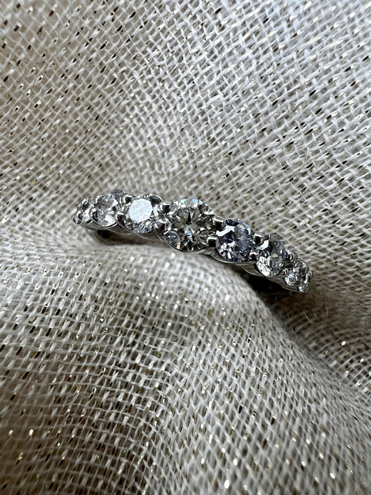 Diamond band with larger middle stone