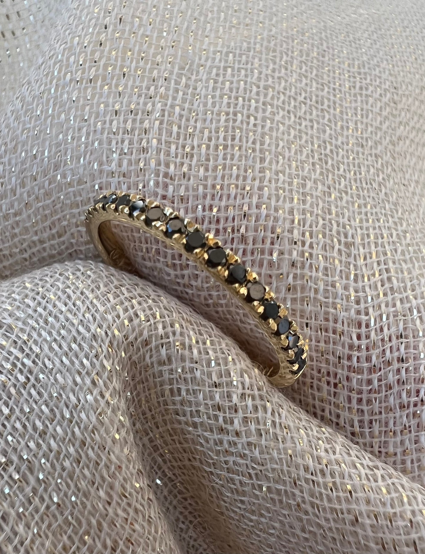 Black diamond half eternity ring in yellow gold