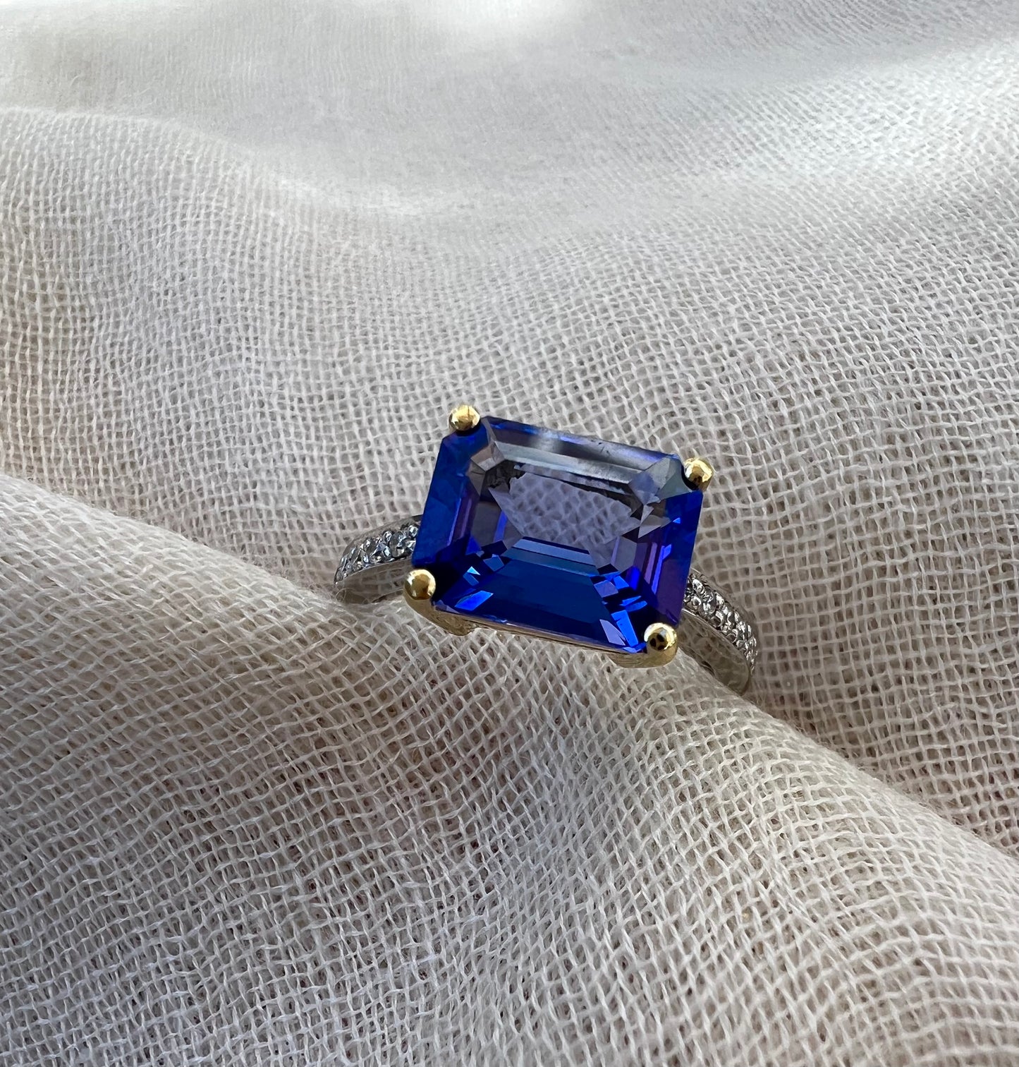 Tanzanite Emerald cut ring in yellow and white gold