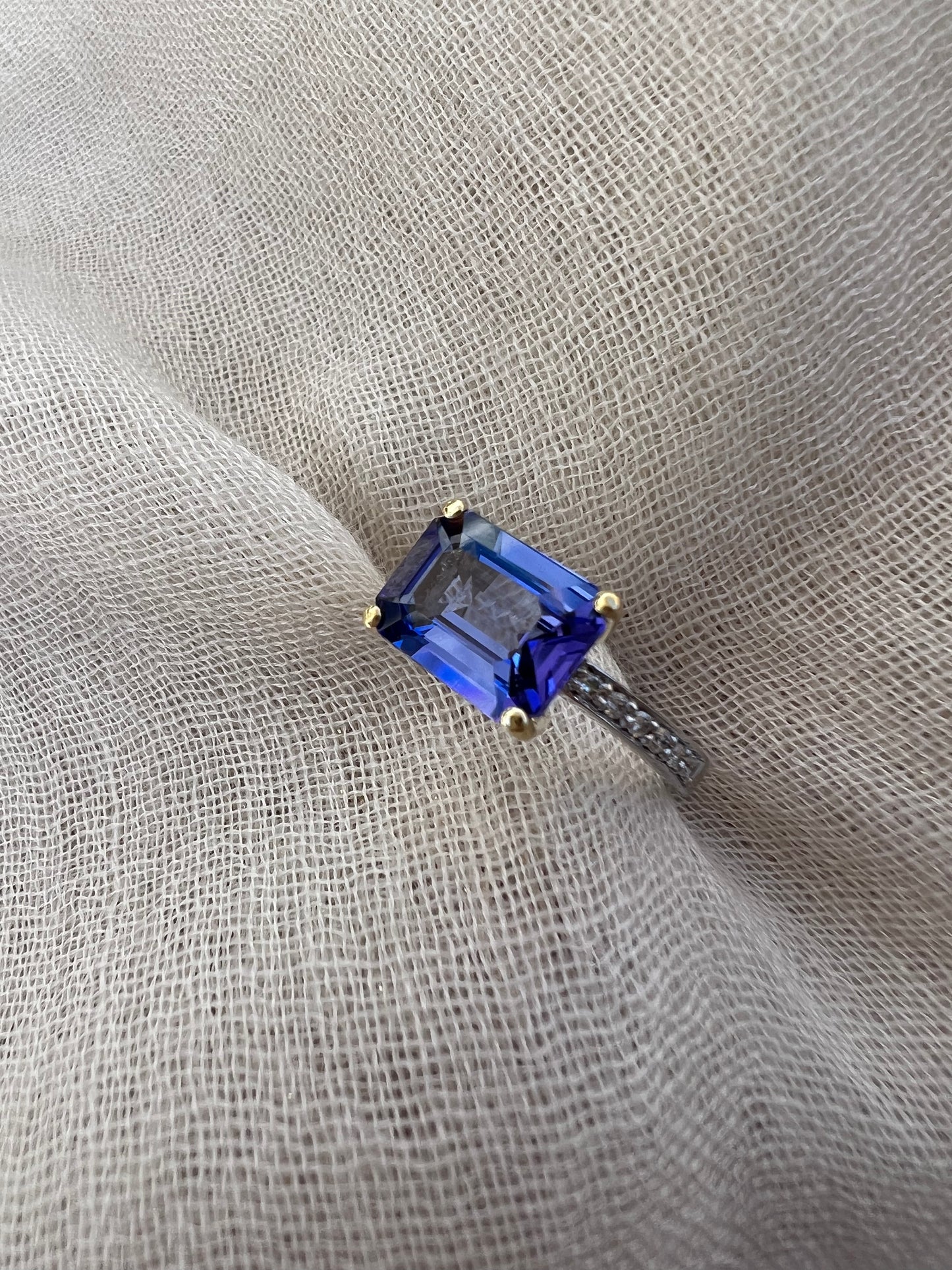 Tanzanite Emerald cut ring in yellow and white gold