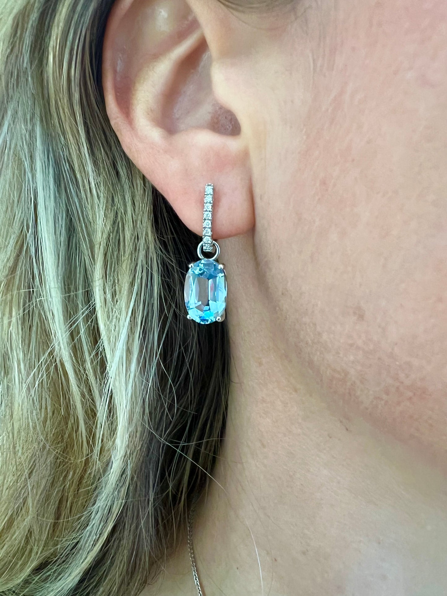 Aquamarine oval drop earrings .