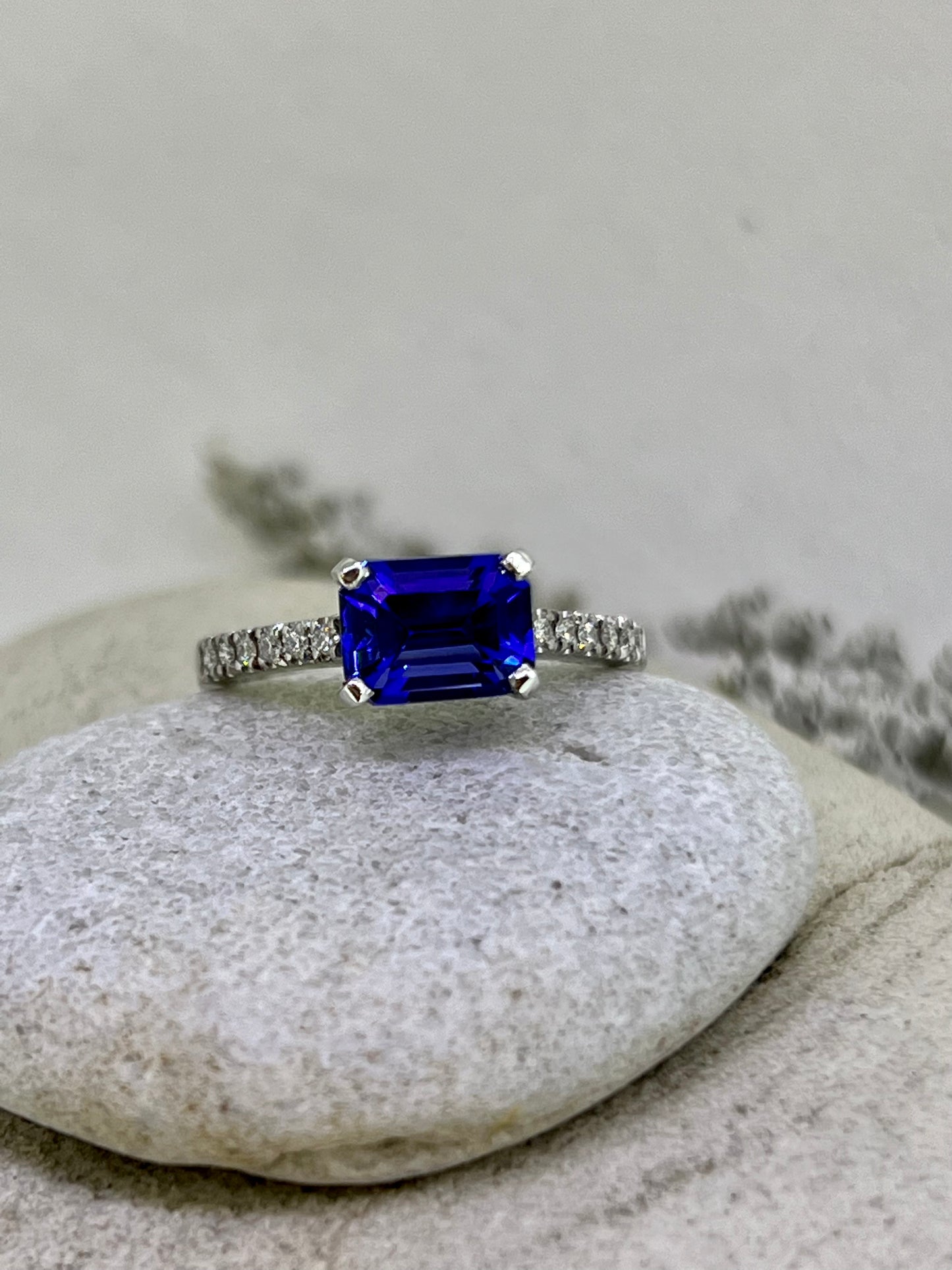 Emerald cut Tanzanite side ring.