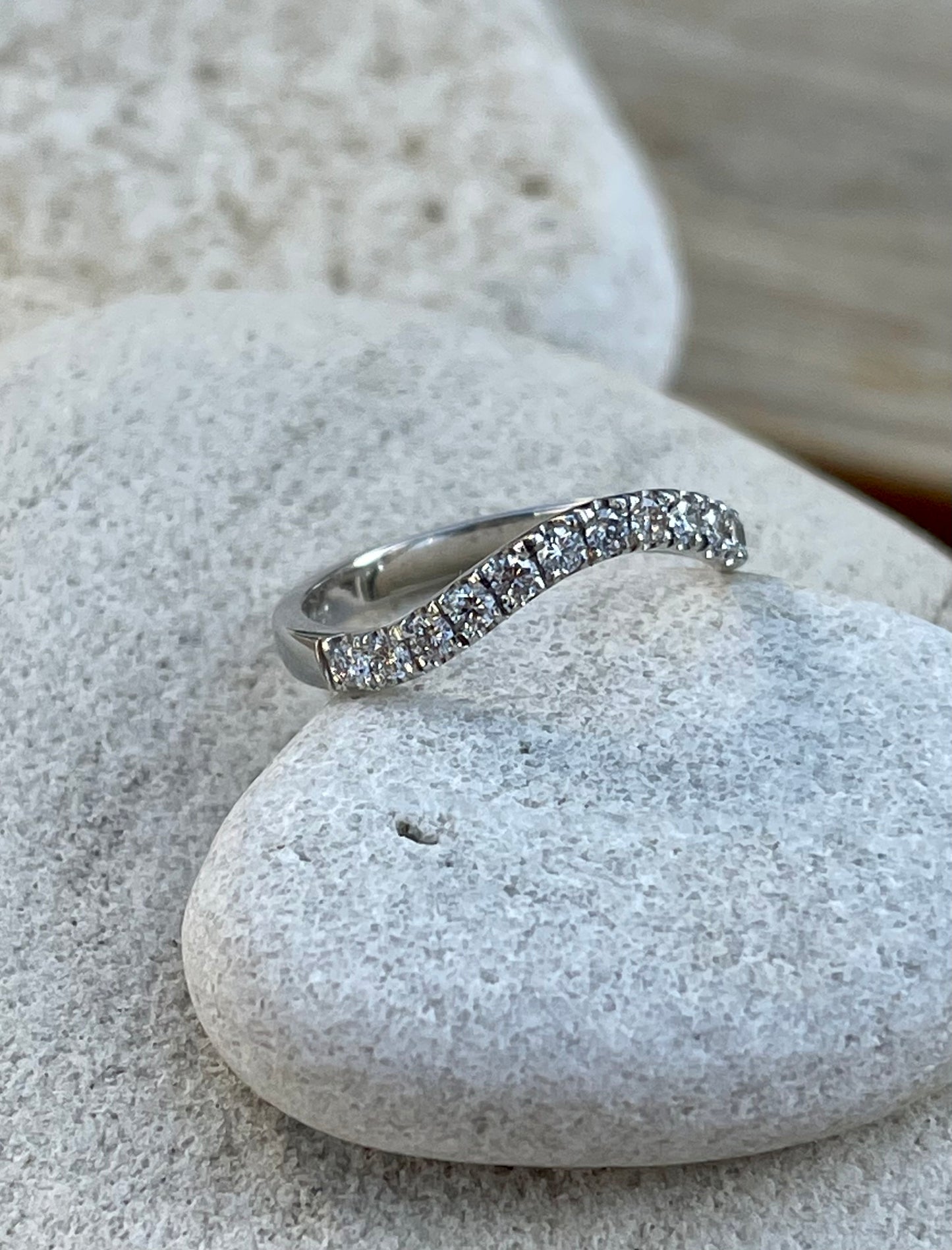 Curved eternity band.