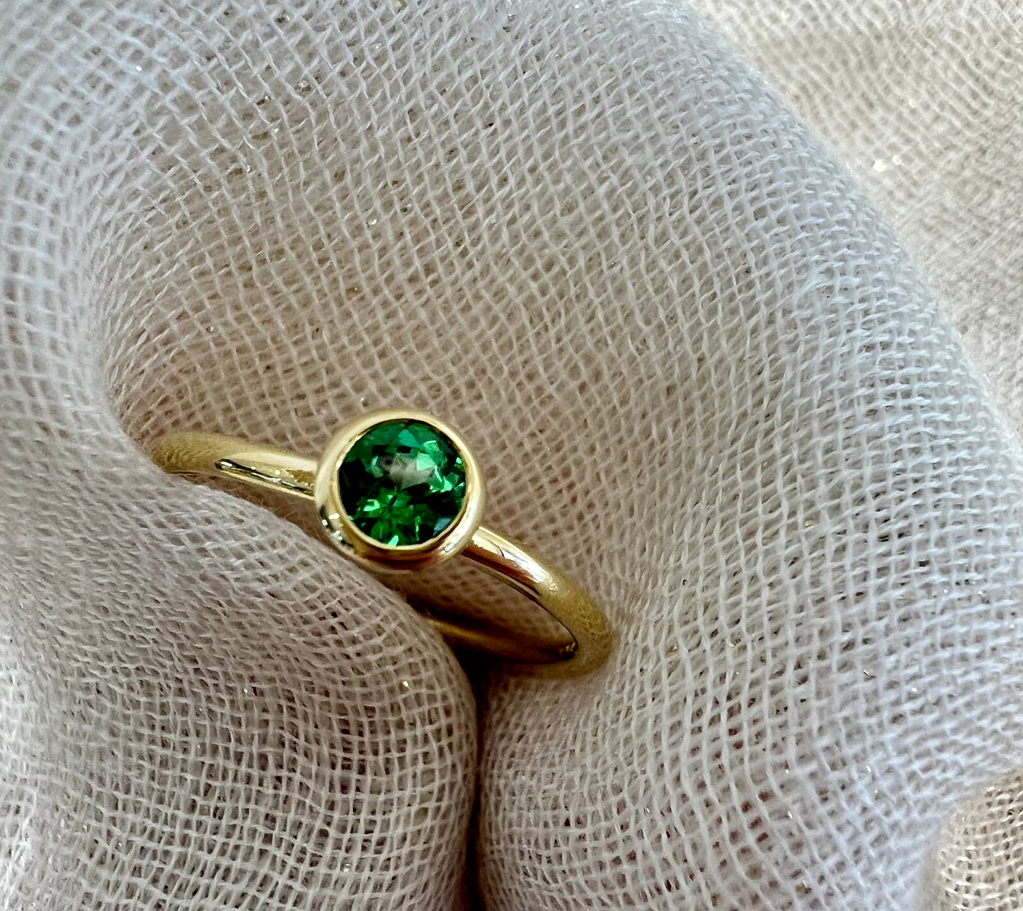 Tsavorite tube set ring in yellow gold