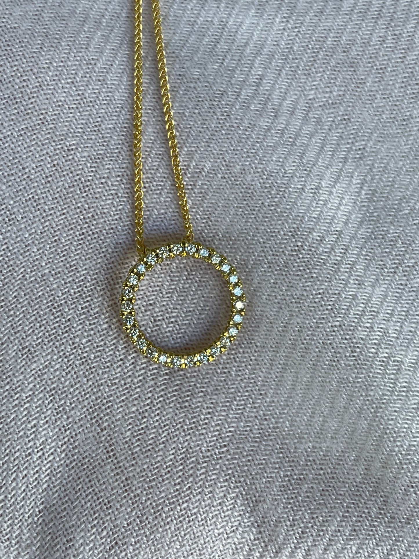 Yellow gold diamond circle pendant