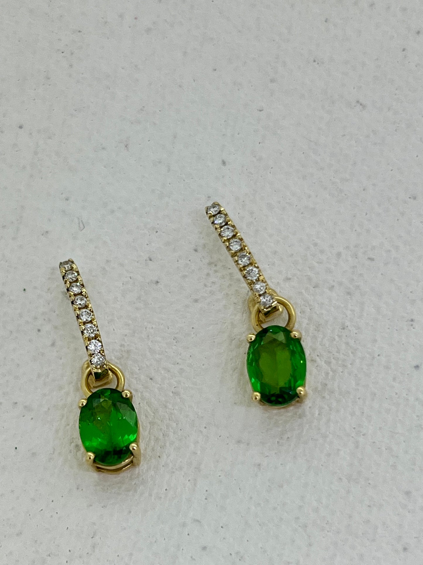 Tsavorite ovals on yellow diamonds Huggies