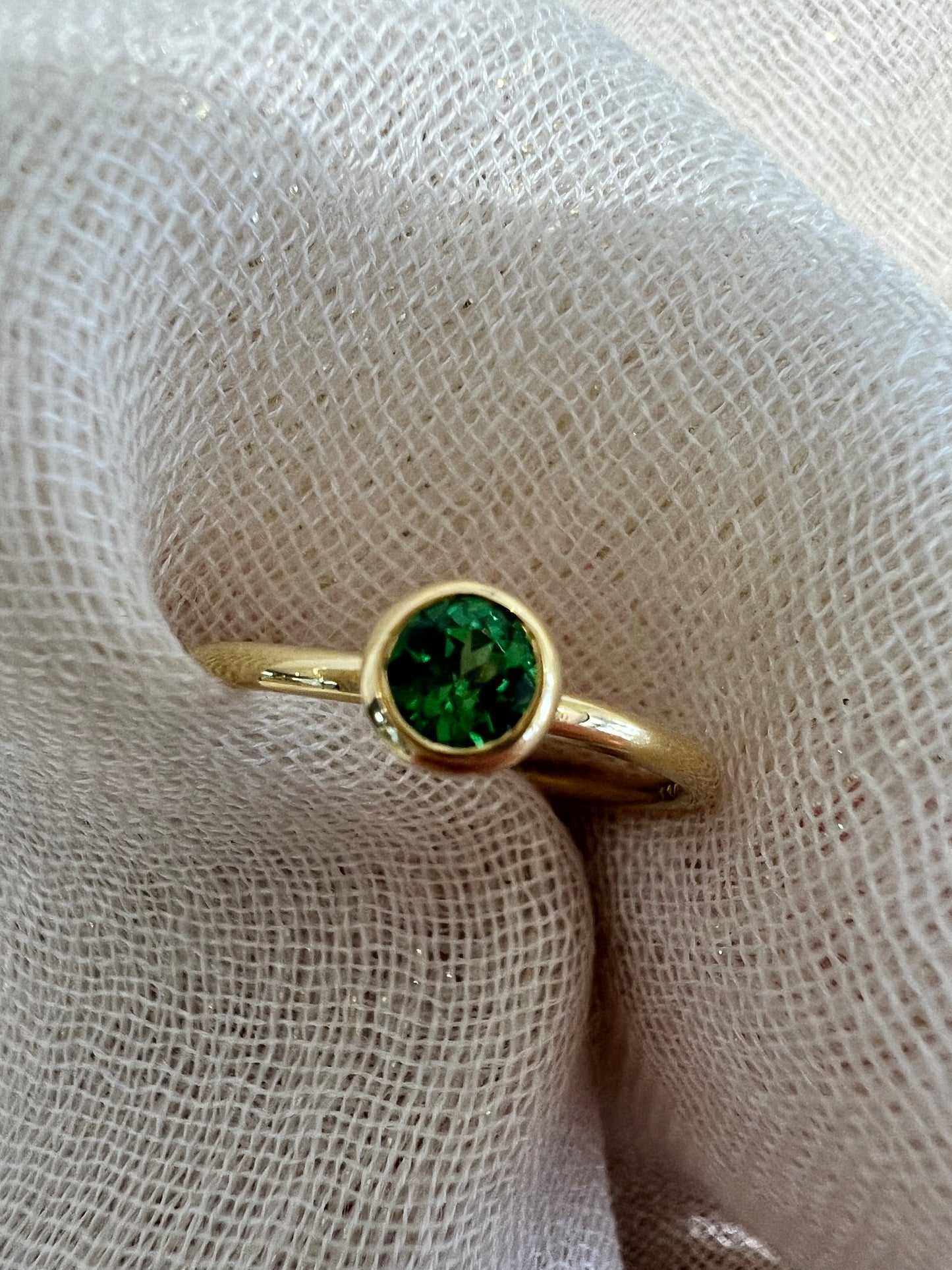 Tsavorite tube set ring in yellow gold