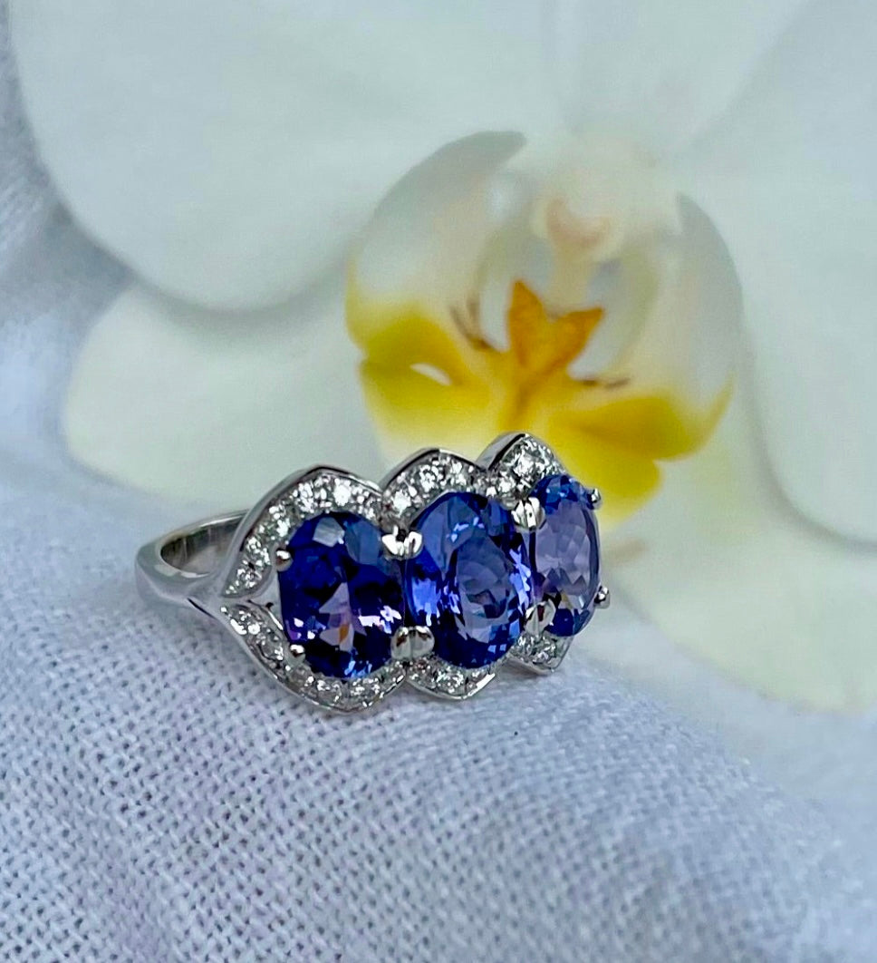 Tri Tanzanite oval halo ring