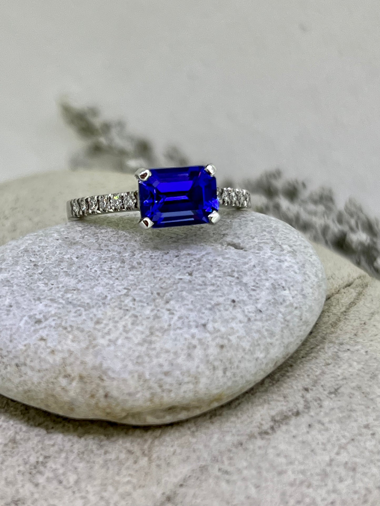 Emerald cut Tanzanite side ring.