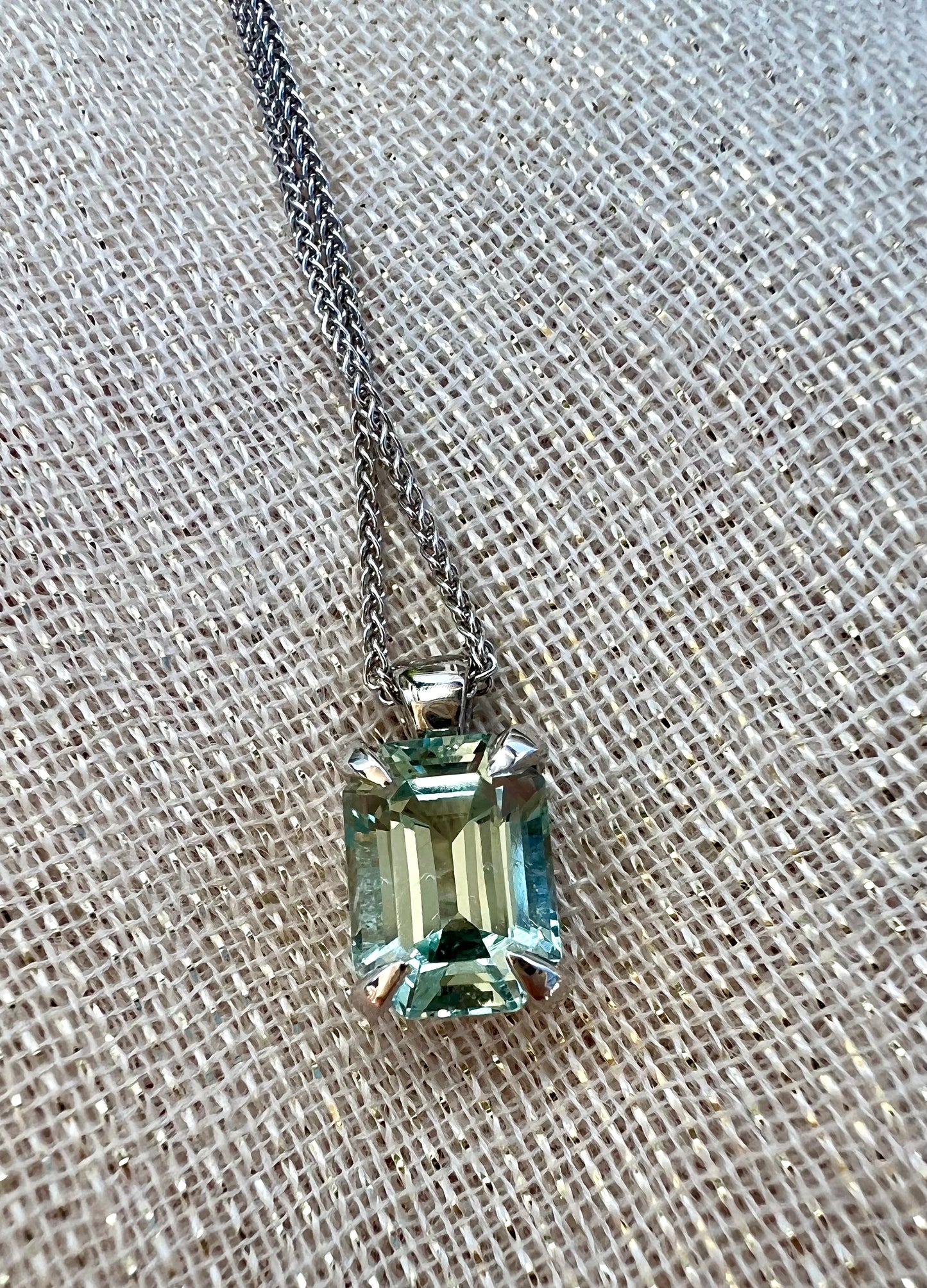 Aquamarine emerald cut pendant on chain