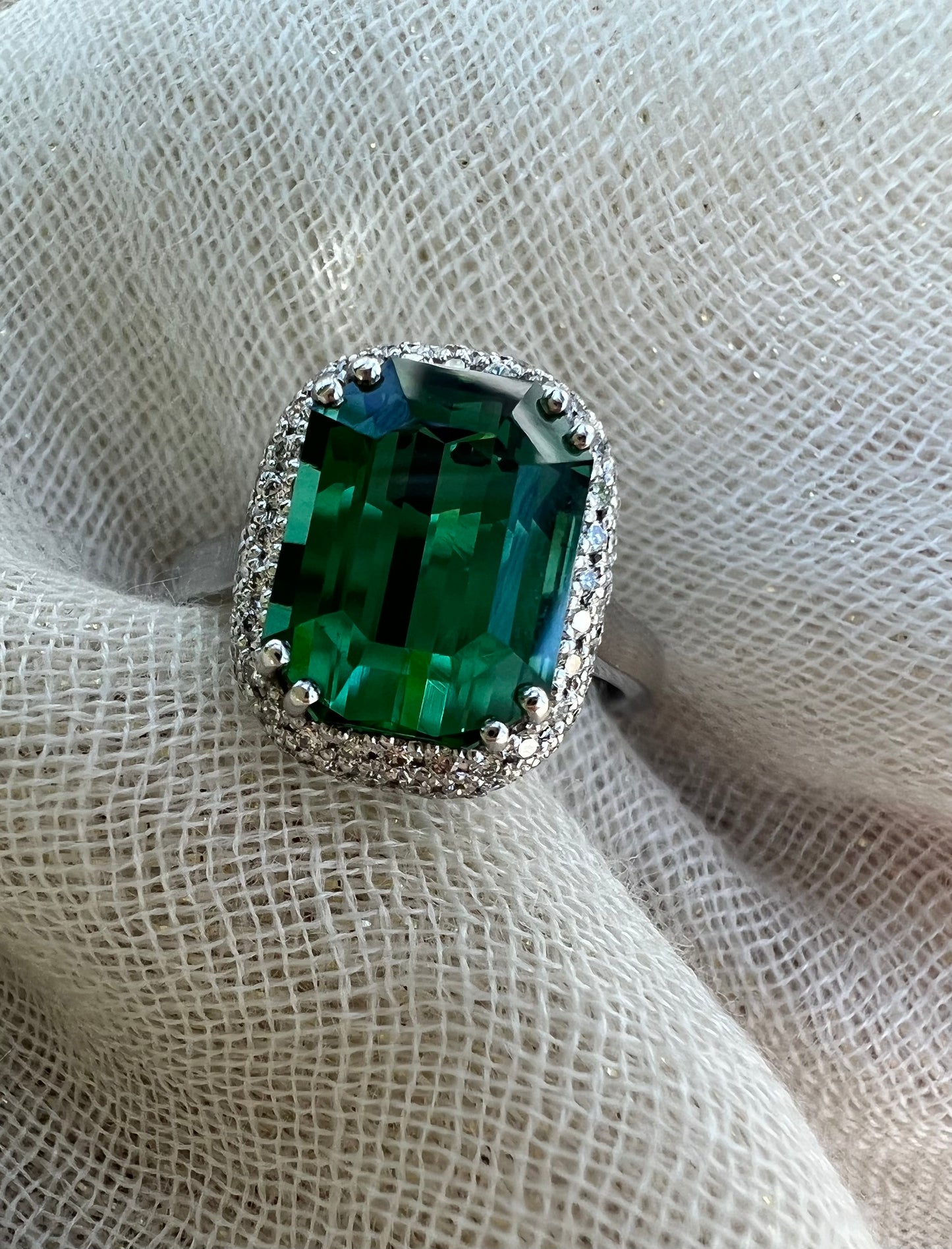 Green Tourmaline ring with double halo of diamonds