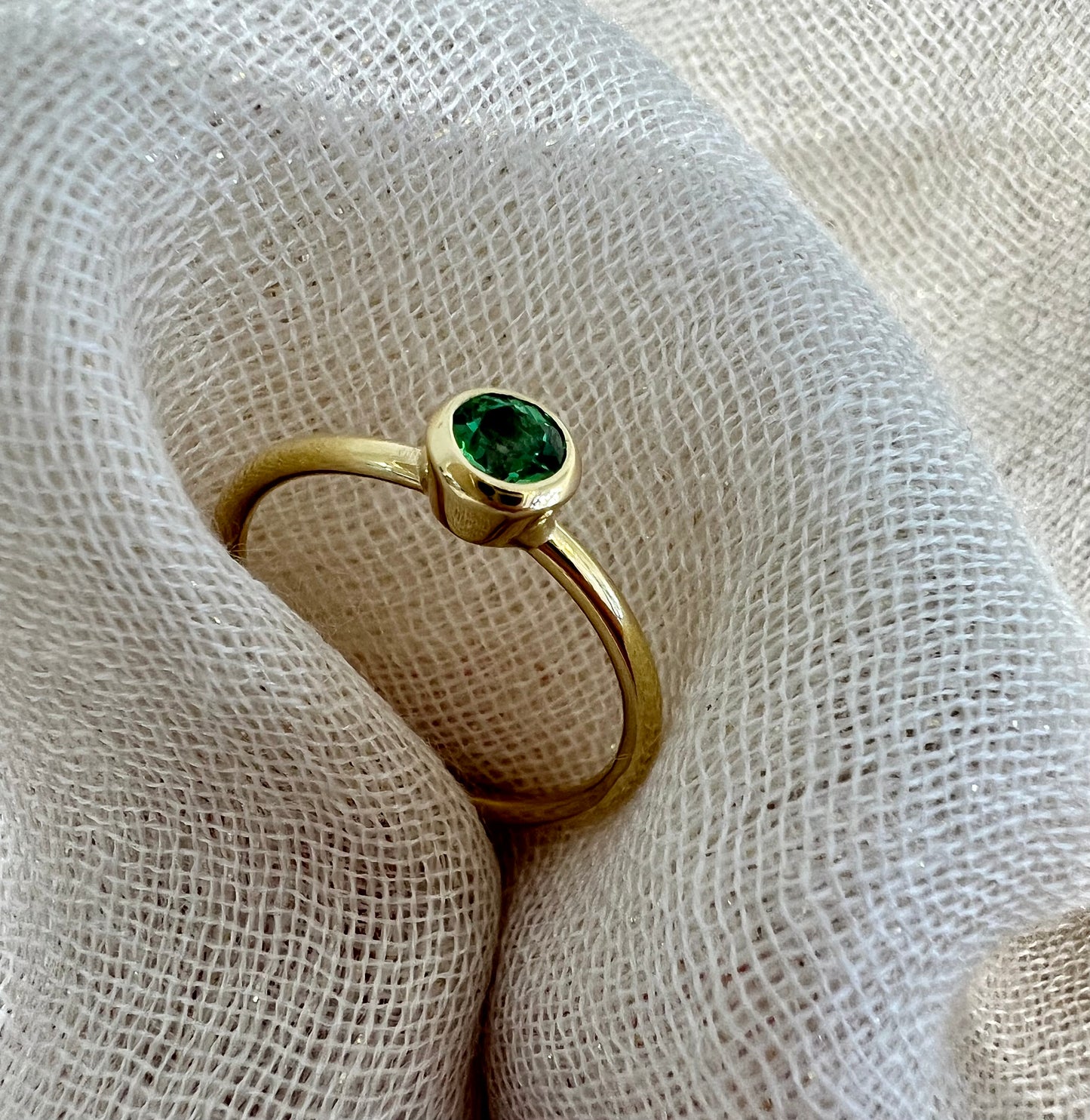 Tsavorite tube set ring in yellow gold