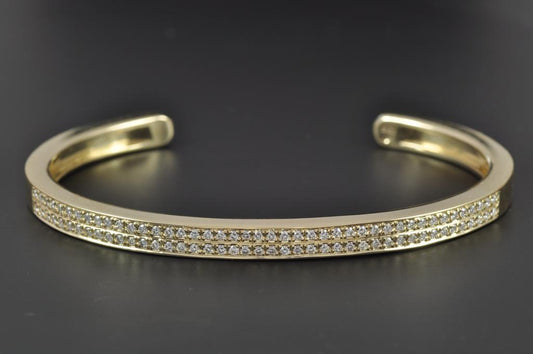 Yellow gold cuff bangle with diamonds