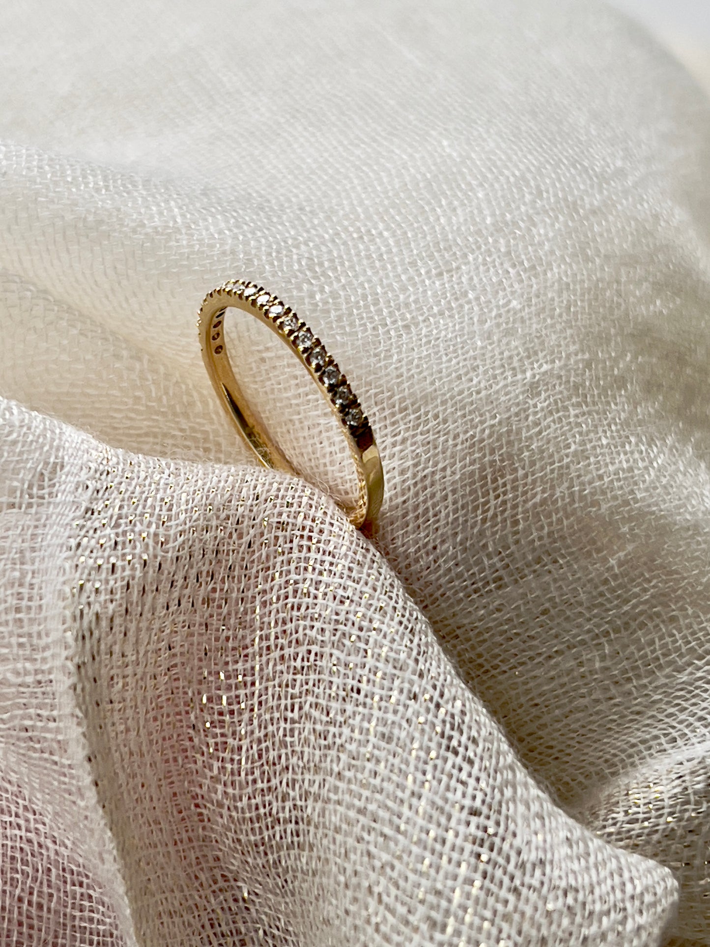 Yellow gold half eternity band