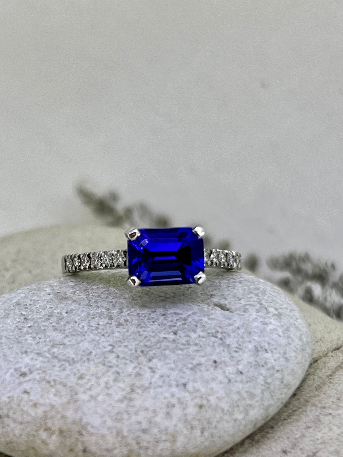 Emerald cut Tanzanite side ring.