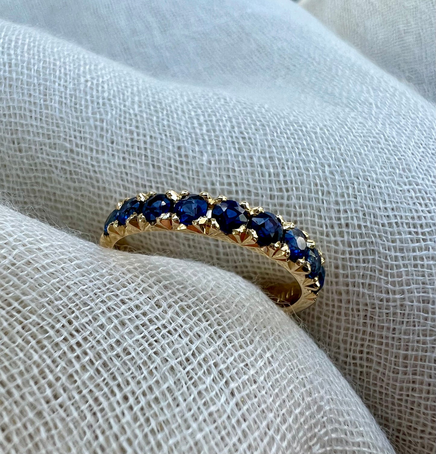 Sapphire half eternity band