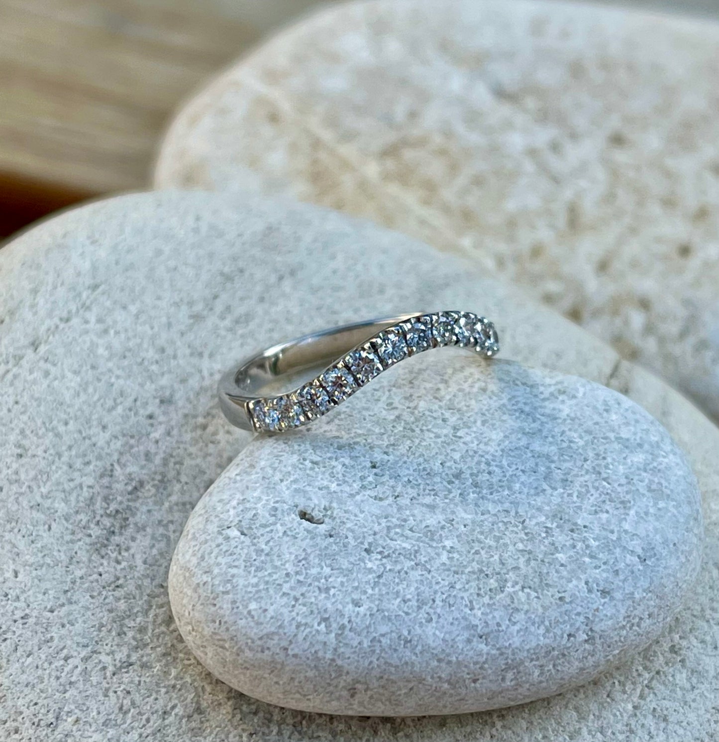 Curved eternity band.