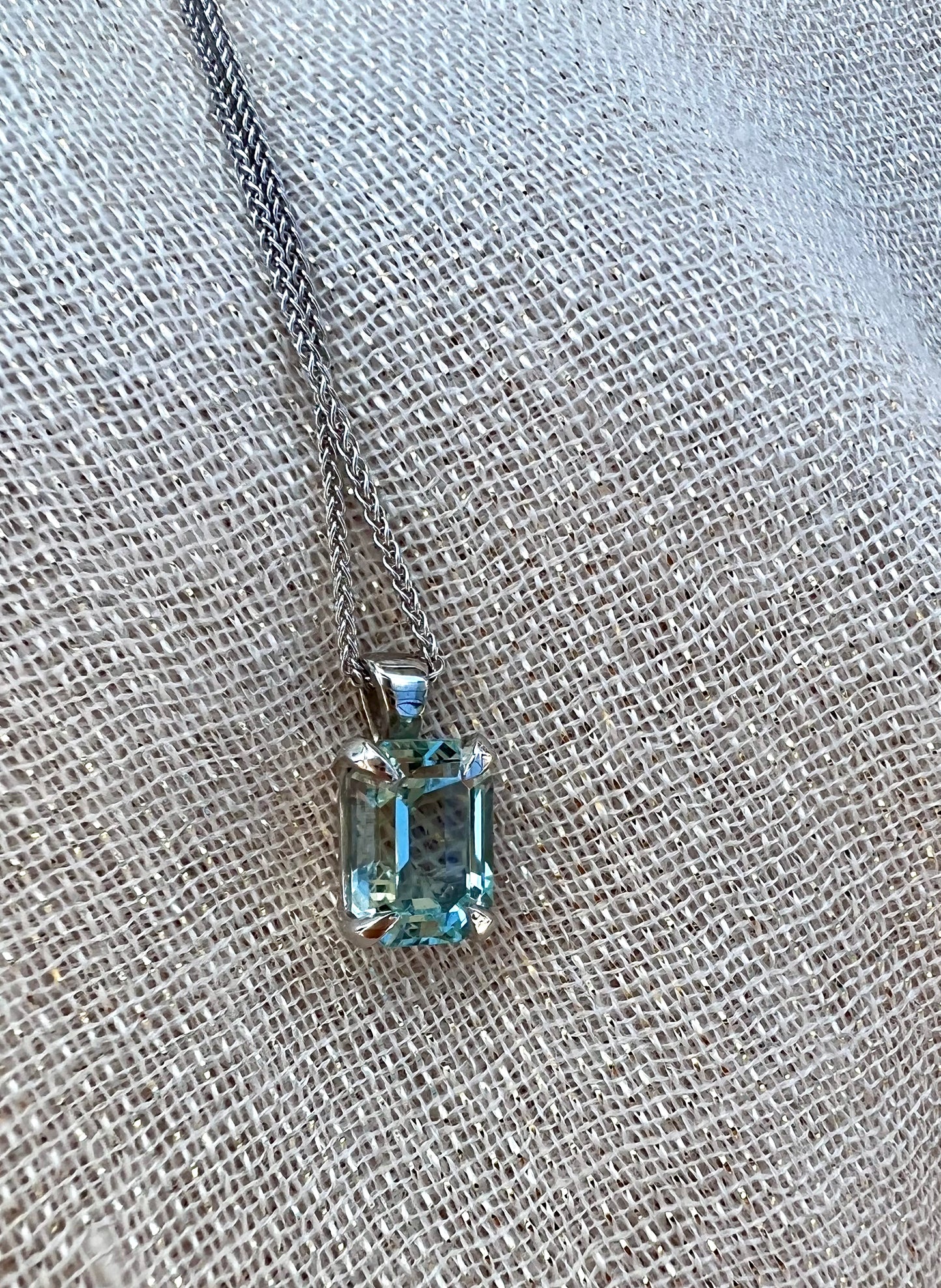 Aquamarine emerald cut pendant on chain