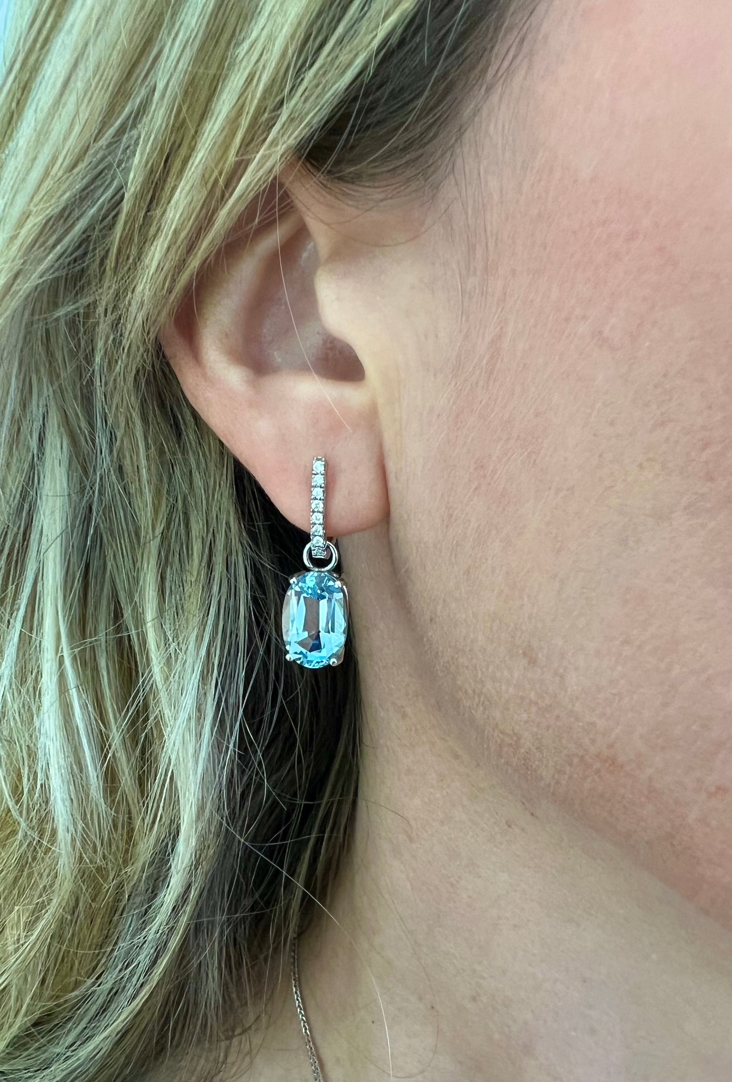 Aquamarine oval drop earrings .