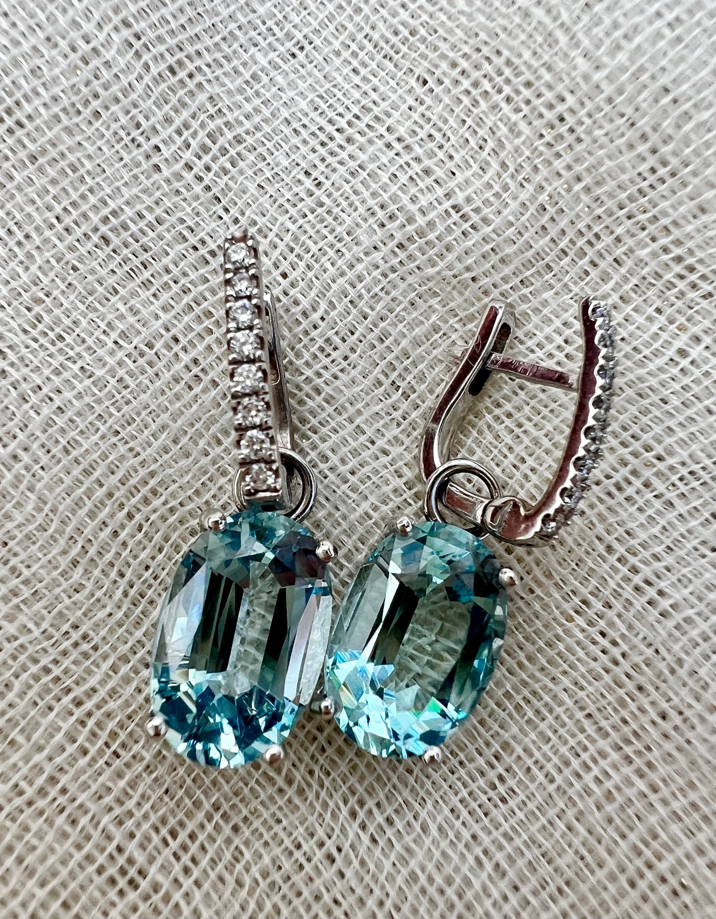 Aquamarine oval drop earrings .