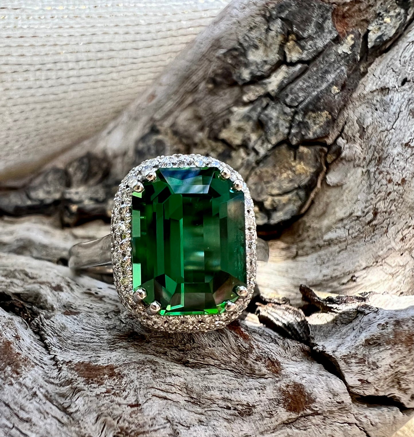 Green Tourmaline ring with double halo of diamonds